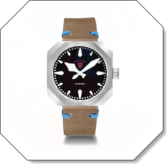 Normalzeit Der Kommissar automatic watch with black dial, brushed octagonal steel case, and olive leather strap with blue stitching in octagonal frame