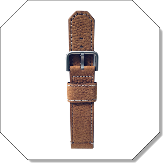Normalzeit tan nubuk leather strap with contrast stitching and black IP buckle, shown in octagonal frame